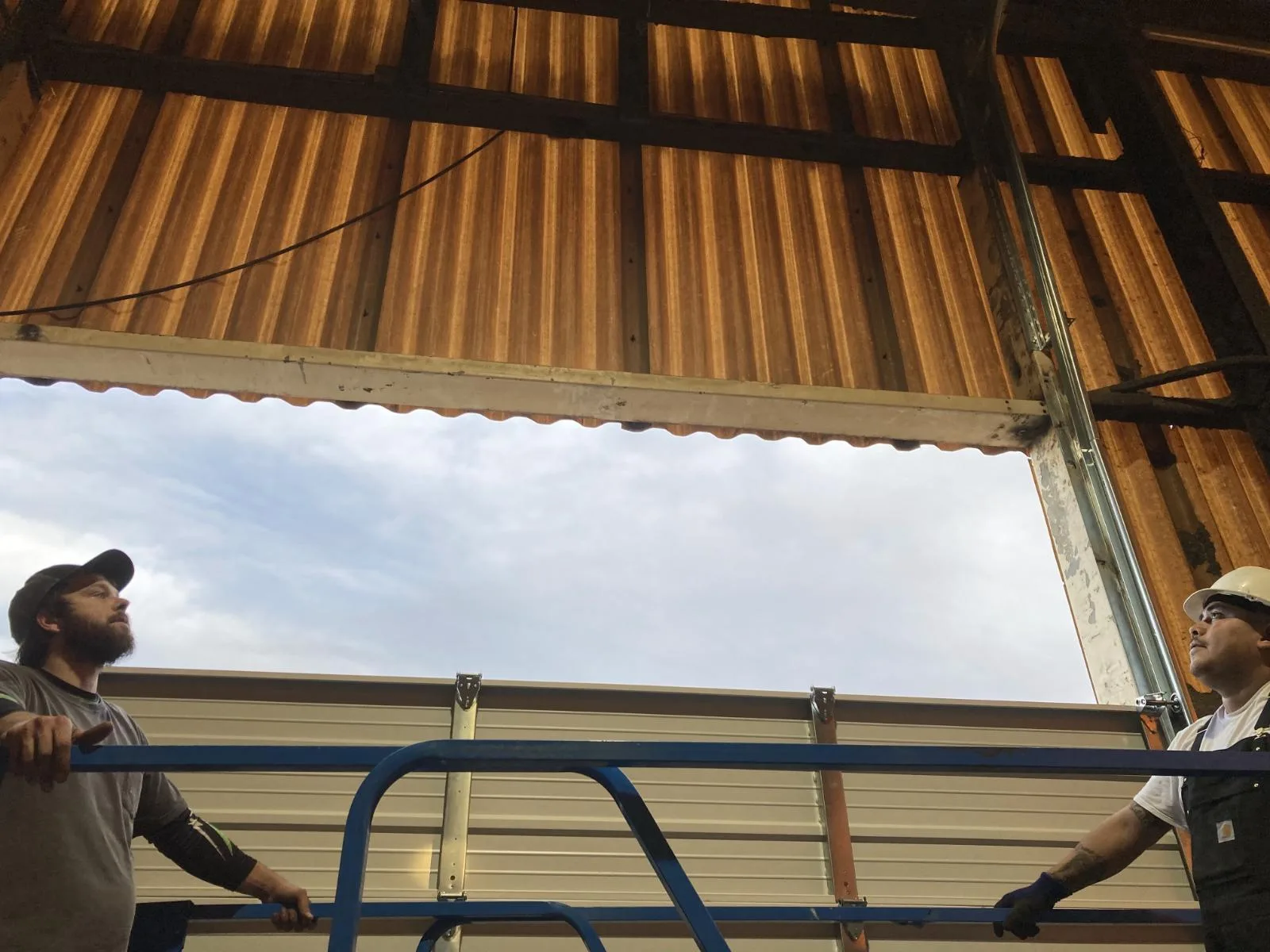 Shawn's crew on scissor lift for commercial barn installation