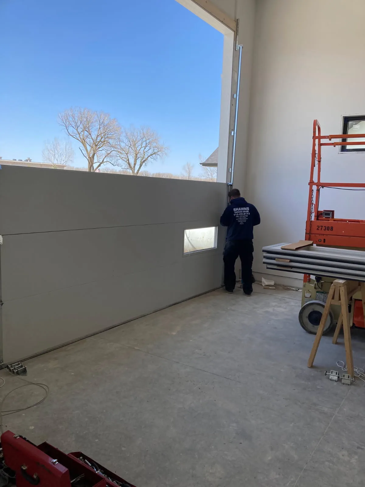 Chamberlain opener and new door installation in progress