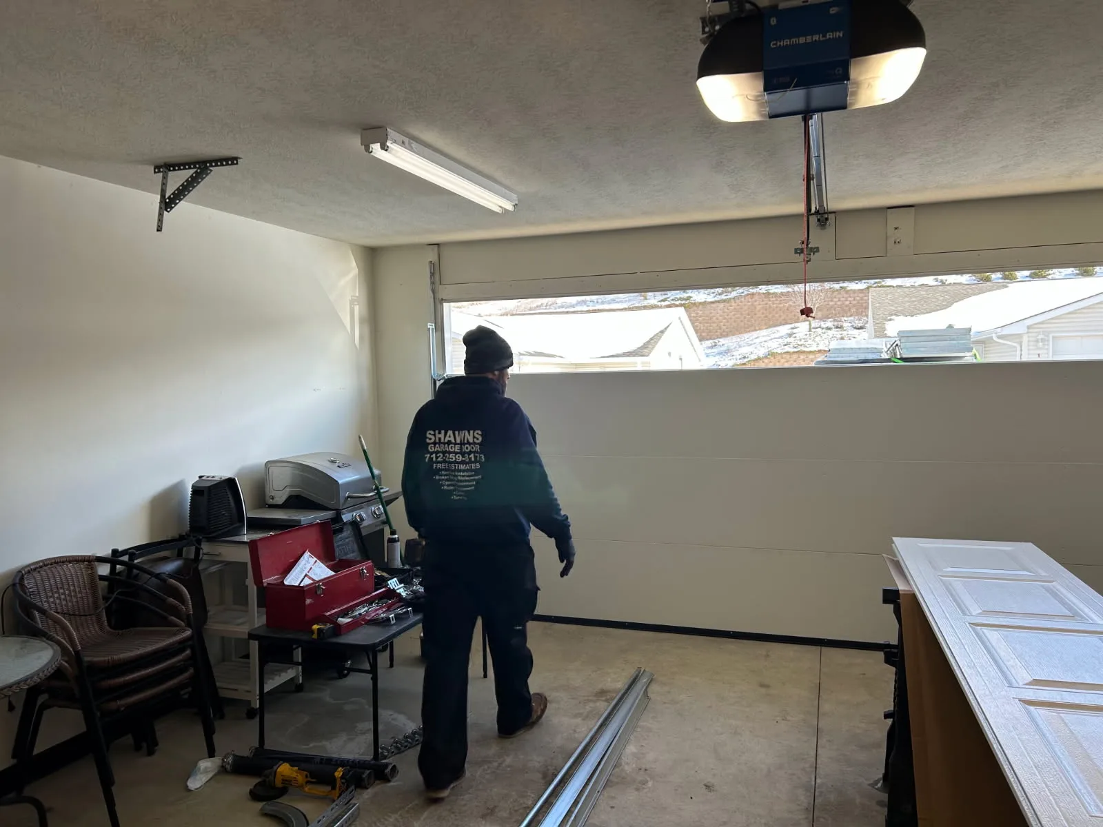 New garage door and opener installed interior view