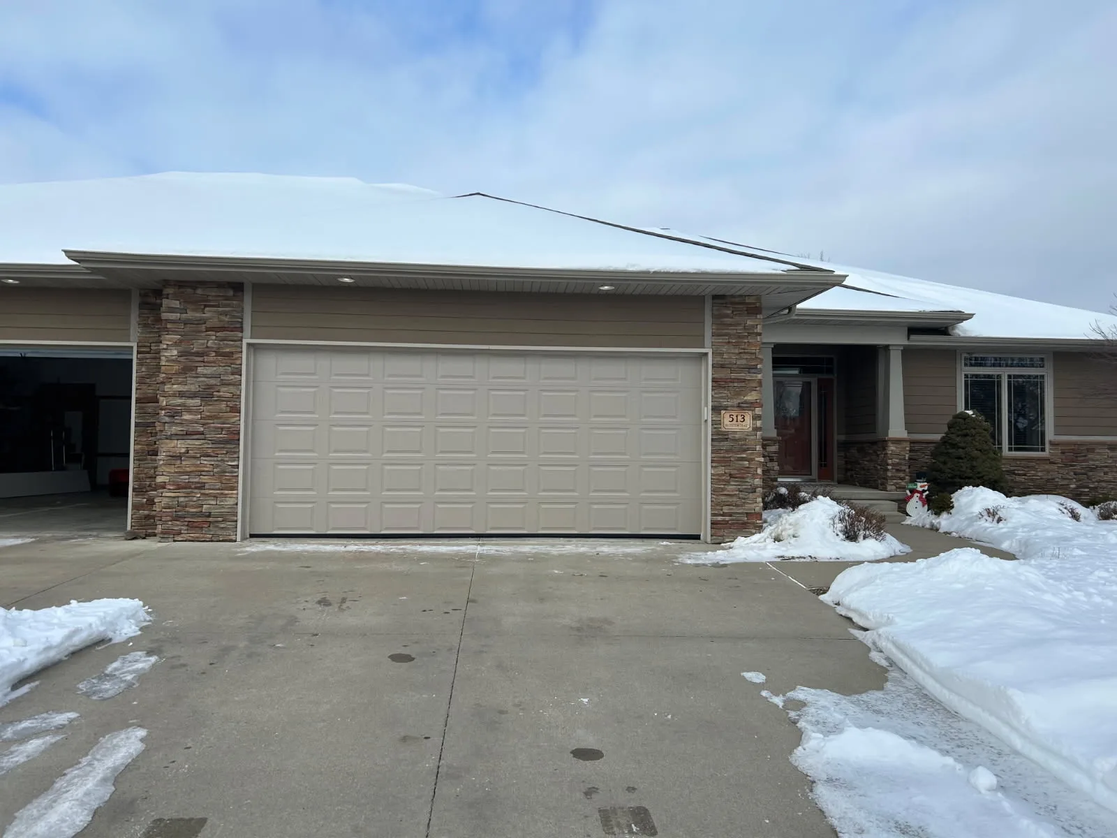 Shawn's Garage Door truck at completed dual door installation