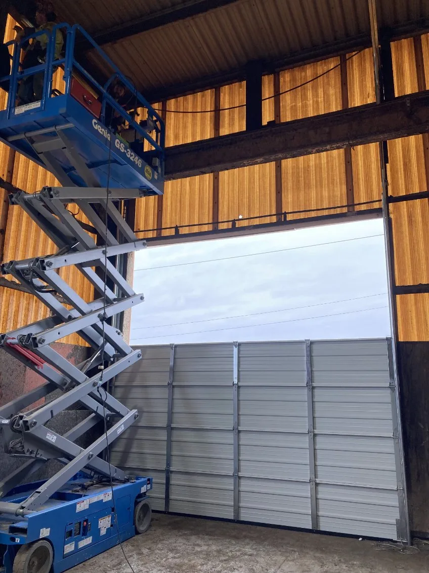 Shawn's Garage Door branded Silverado truck at job site